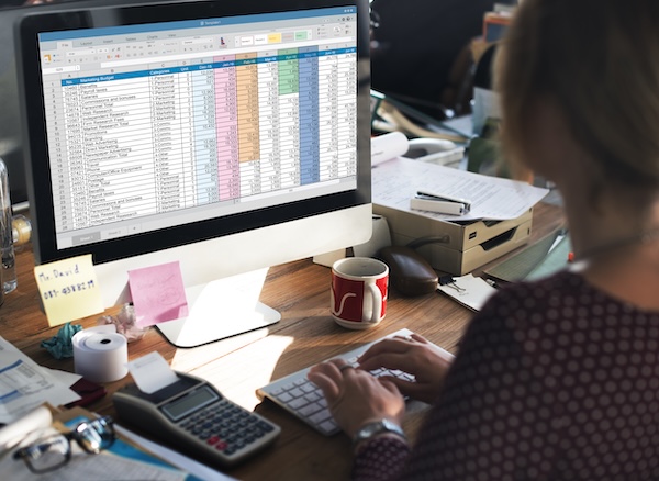 People looking at spreadsheet (from https://www.freepik.com)